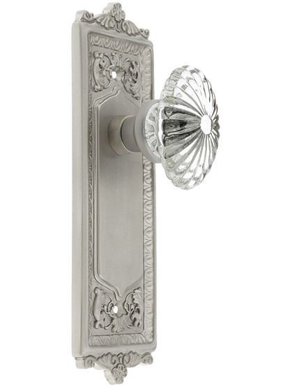 Egg and Dart Plate with Oval Fluted Crystal Knob without Keyhole in Satin Nickel.